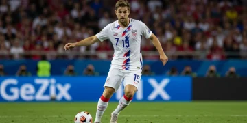 Dynamic American box-to-box midfielder in action