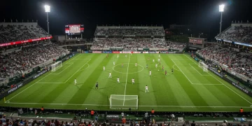 MLS Next Pro 2025 match action with players, stadium lights, and fans