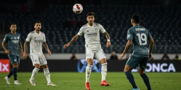MLS playmaker dribbling past defenders on the field, demonstrating skill and vision.