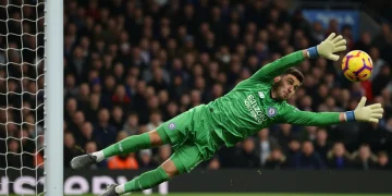 Premier League goalkeeper making a crucial full-stretch save in 2025