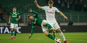 Defender making a perfect slide tackle in a US soccer match